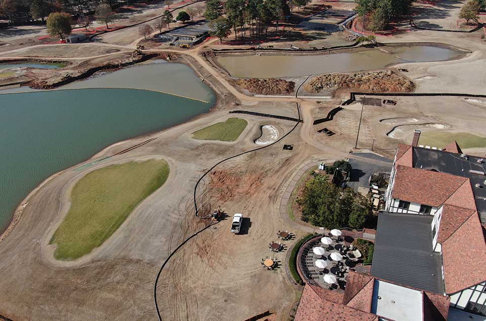 Dredging and dewatering work beside the East Lake Golf Club course